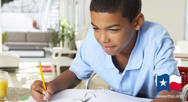 homeschool boy writing an assignment